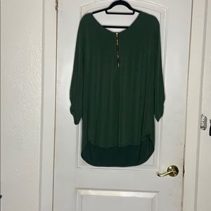 Green blouse with gold zipper on front